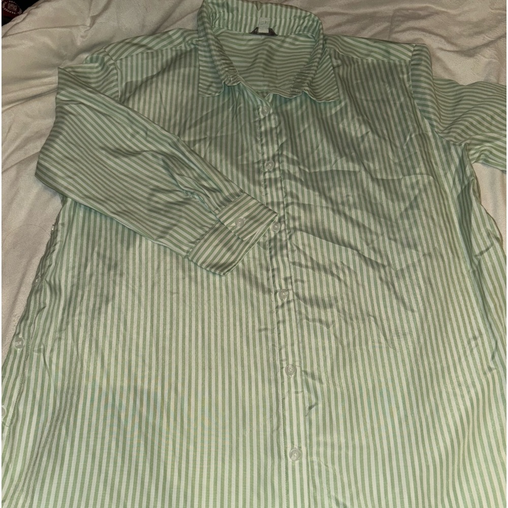 Bought from a boutique. Mint colored button up shirt